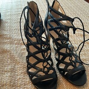 Cage stilletto high heels in black.